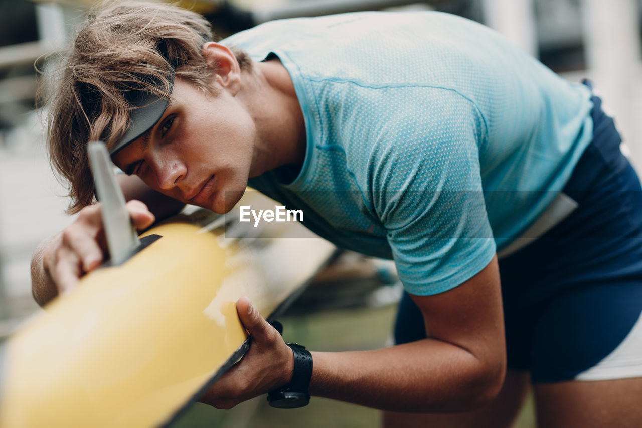 Man inspecting canoe