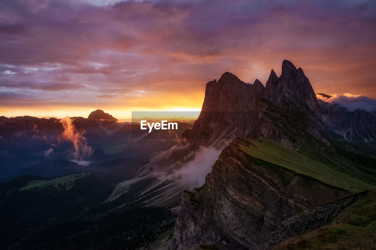 Scenic view of mountains against sky during sunset