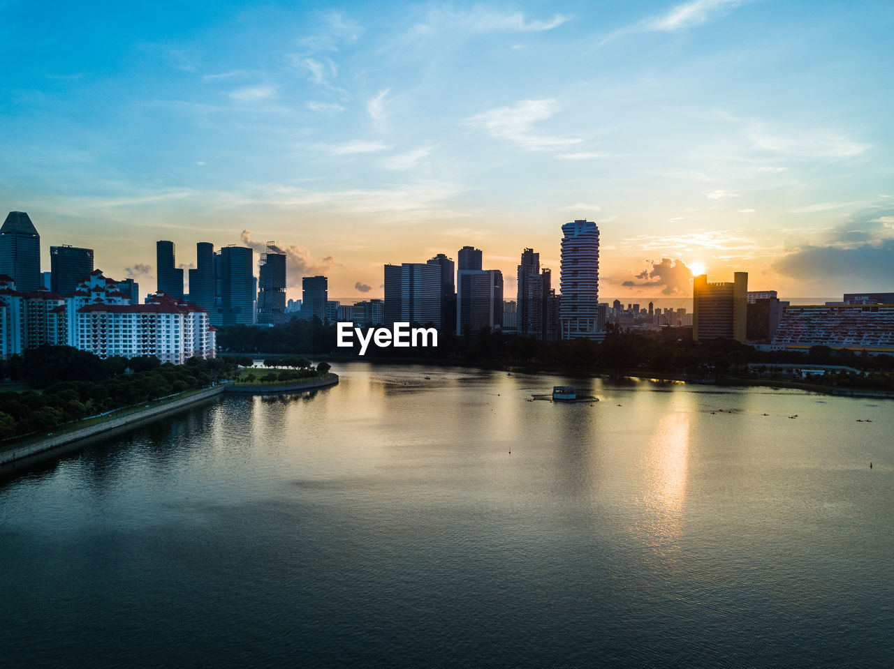 City at waterfront during sunset