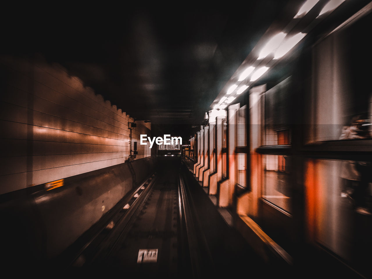 Blurred motion of train at subway station
