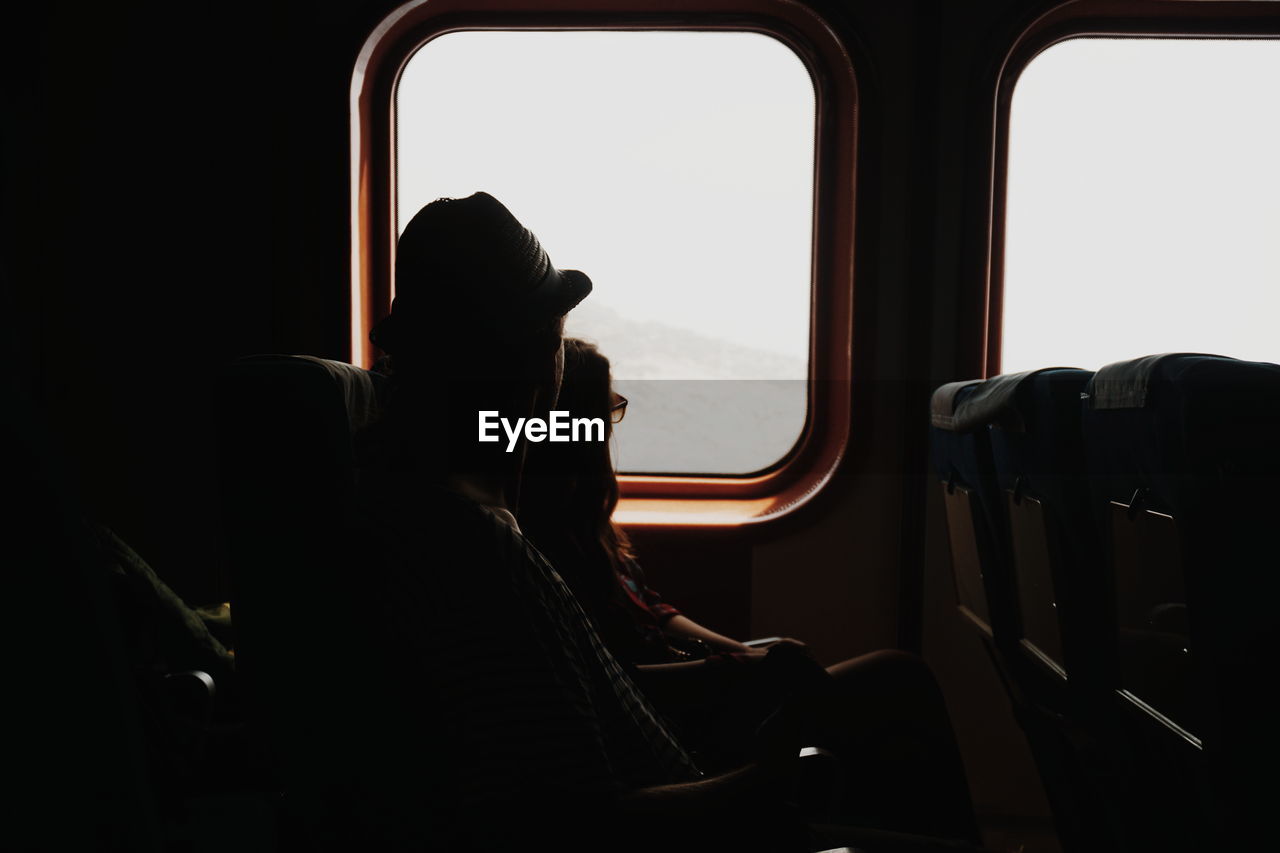 Couple sitting in train