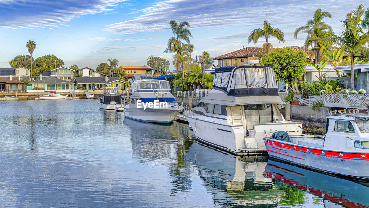 BOATS MOORED IN HARBOR