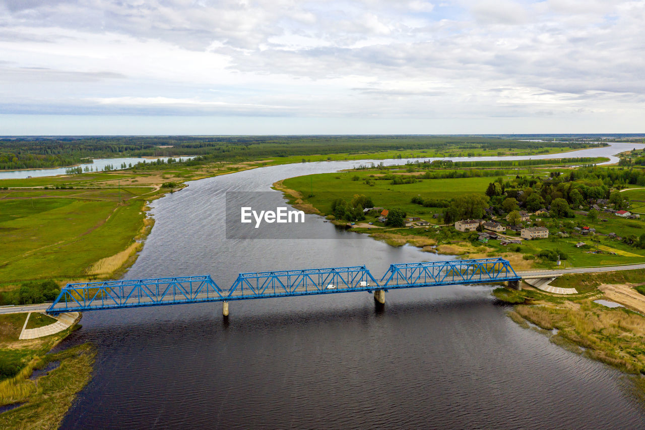 Aerial panoramic view from above to the bridge over the river lielupe near kalnciems, latvia
