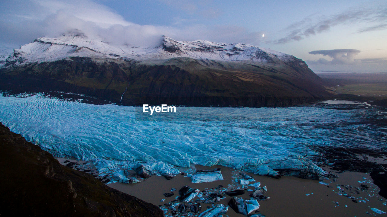 Scenic view of snowcapped glaciar mountains against sky