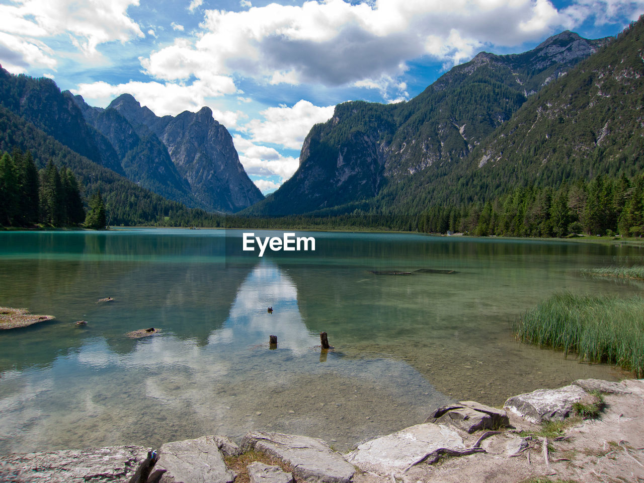 Scenic view of lake and mountains against sky