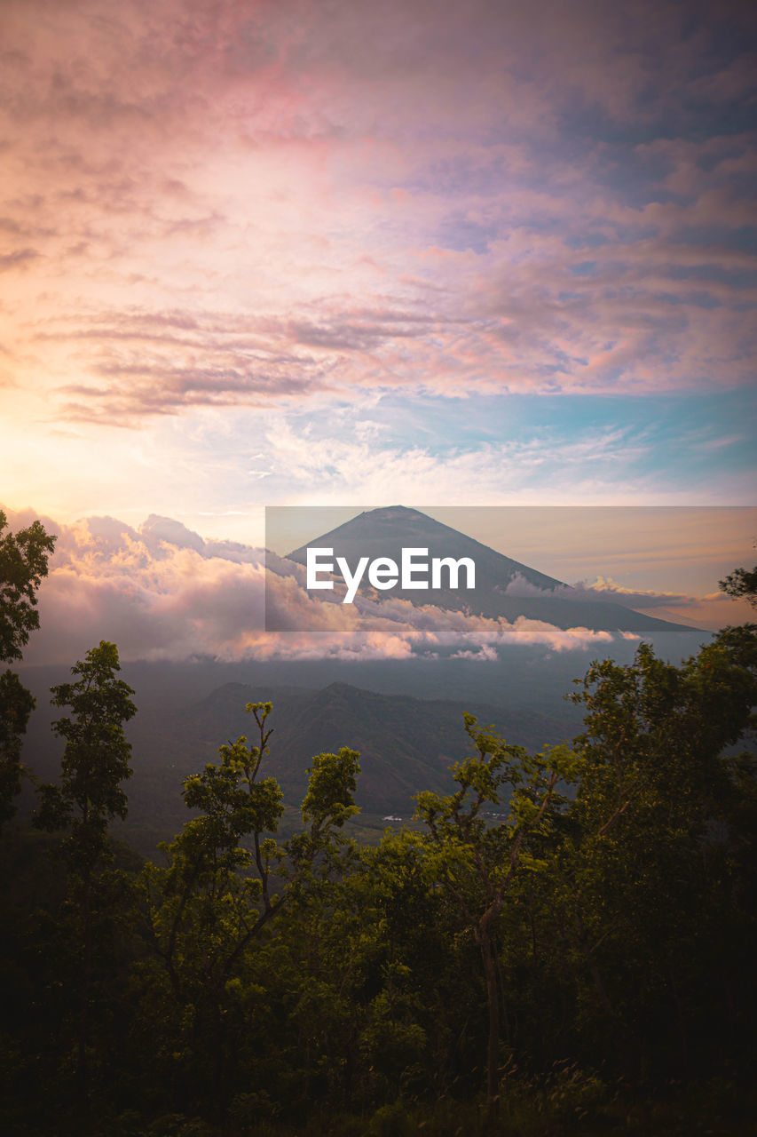 Scenic view of mountains against sky at sunset