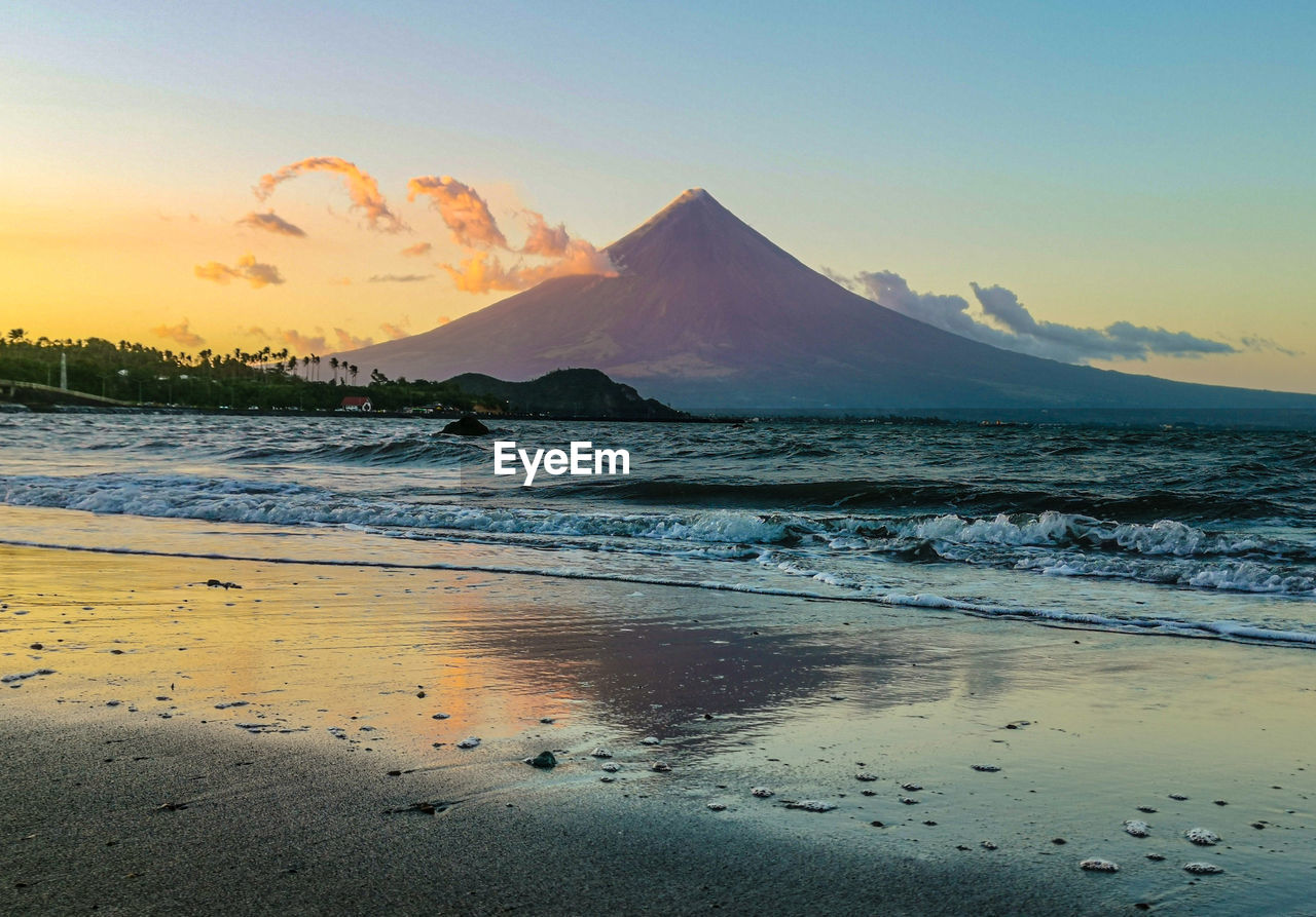 Scenic view of sea against sky during sunset