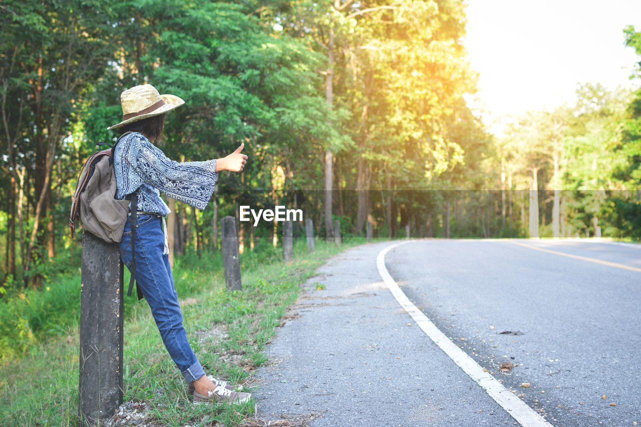 Woman standing on road