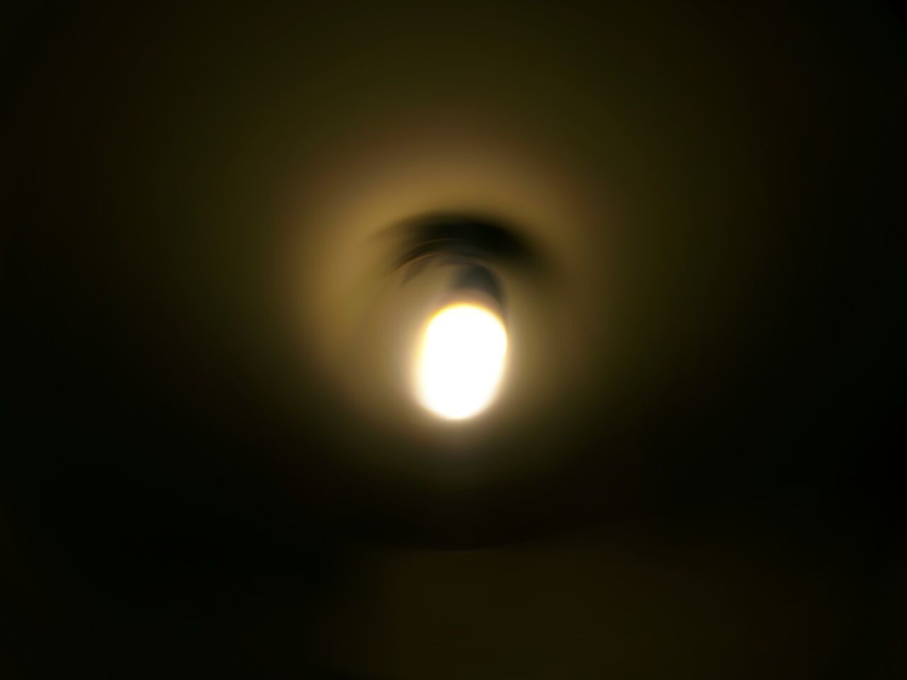 Low angle view of defocused illuminated light bulb