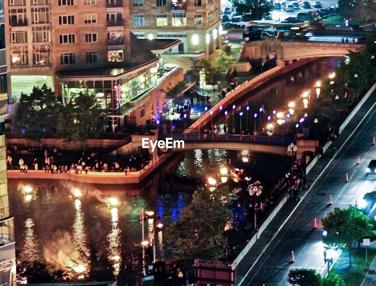 VIEW OF ILLUMINATED BUILDINGS IN CITY