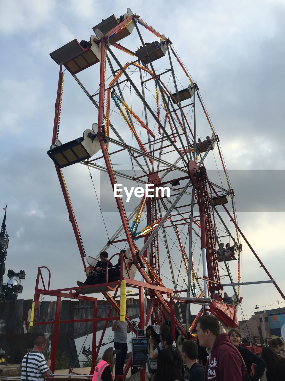 LOW ANGLE VIEW OF FERRIS WHEEL AGAINST SKY