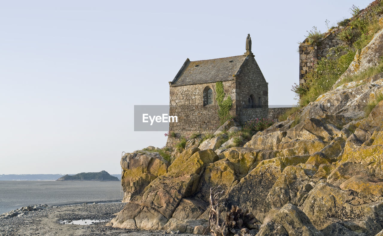 OLD BUILDING ON ROCK