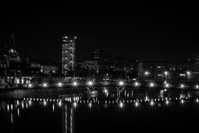 VIEW OF ILLUMINATED BUILDINGS AT NIGHT