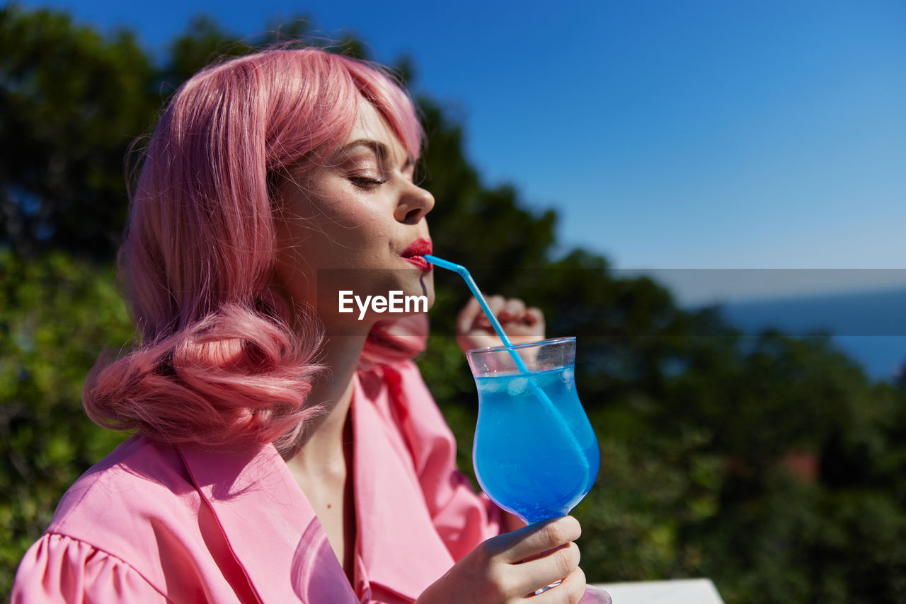 Young woman drinking water