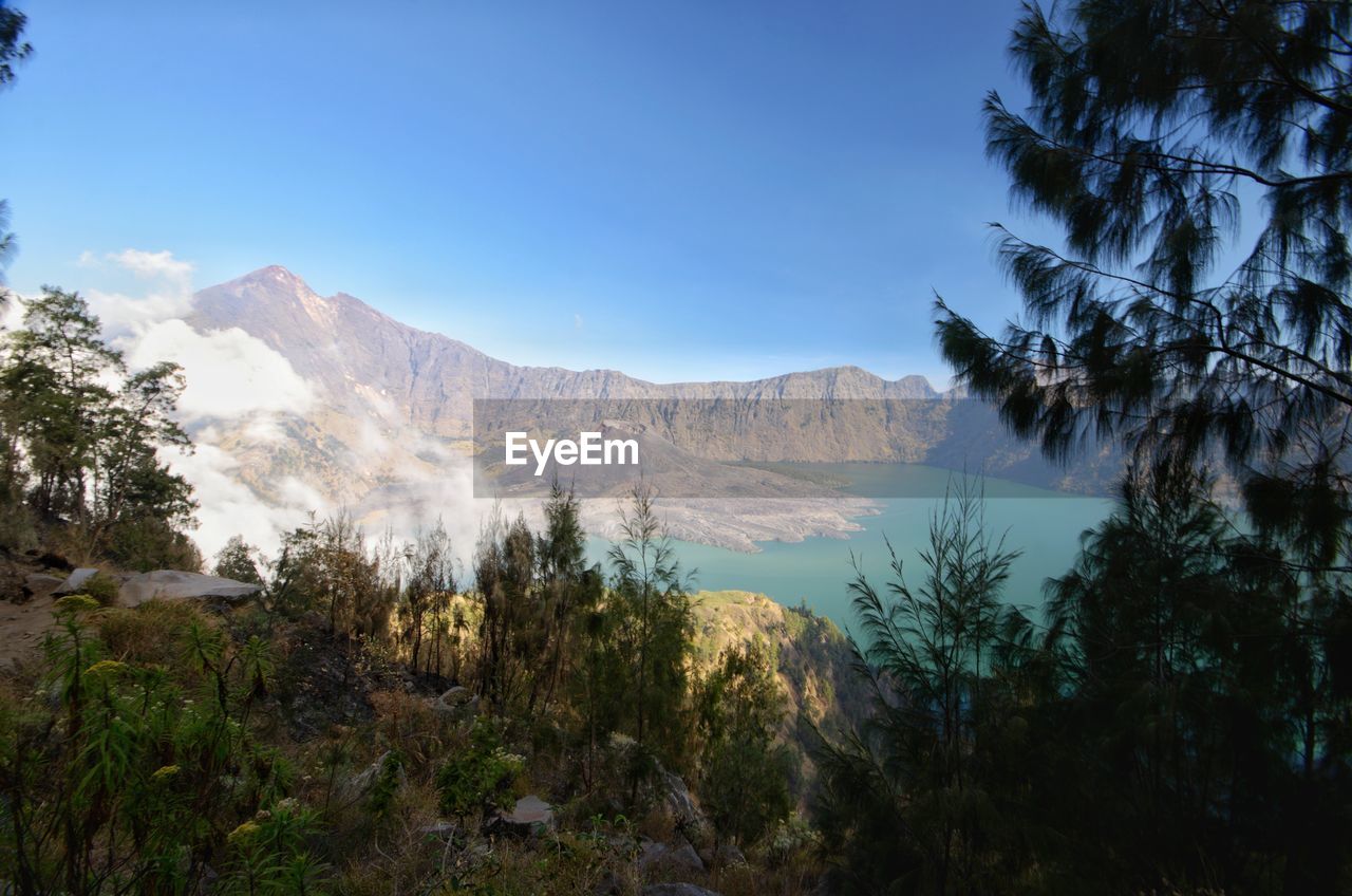 Scenic view of landscape and mountains against sky