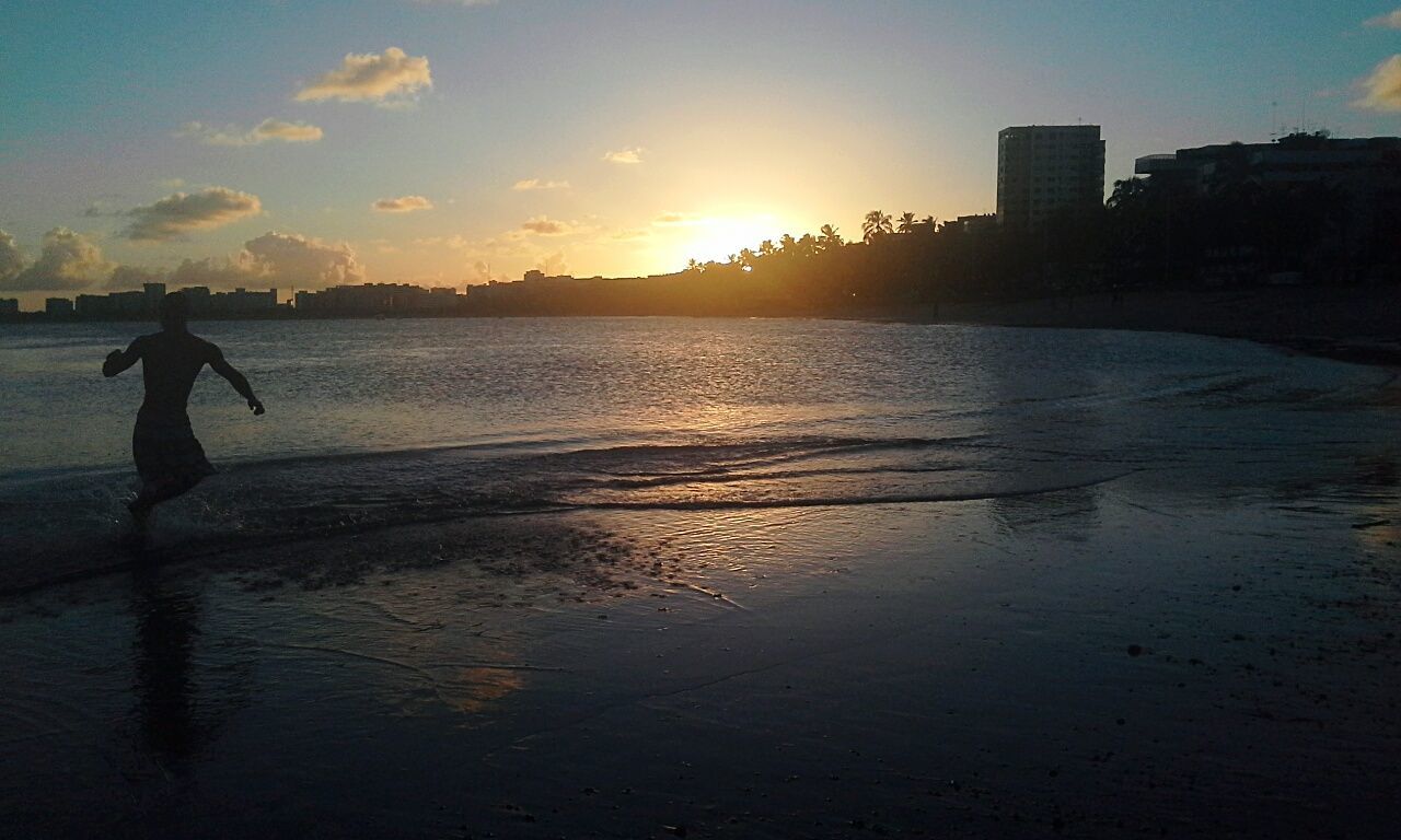 SCENIC VIEW OF SUNSET OVER SEA