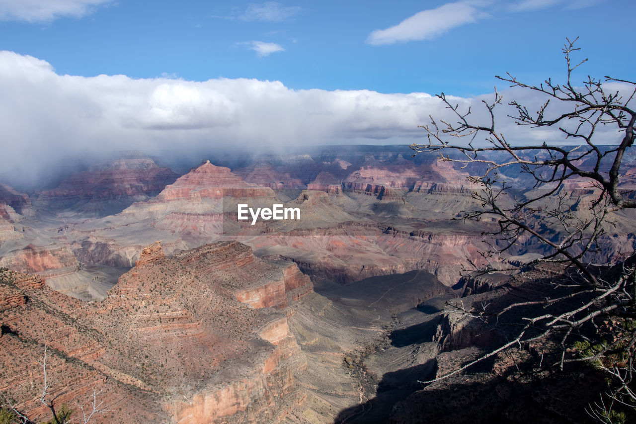 AERIAL VIEW OF CLOUDS OVER MOUNTAIN