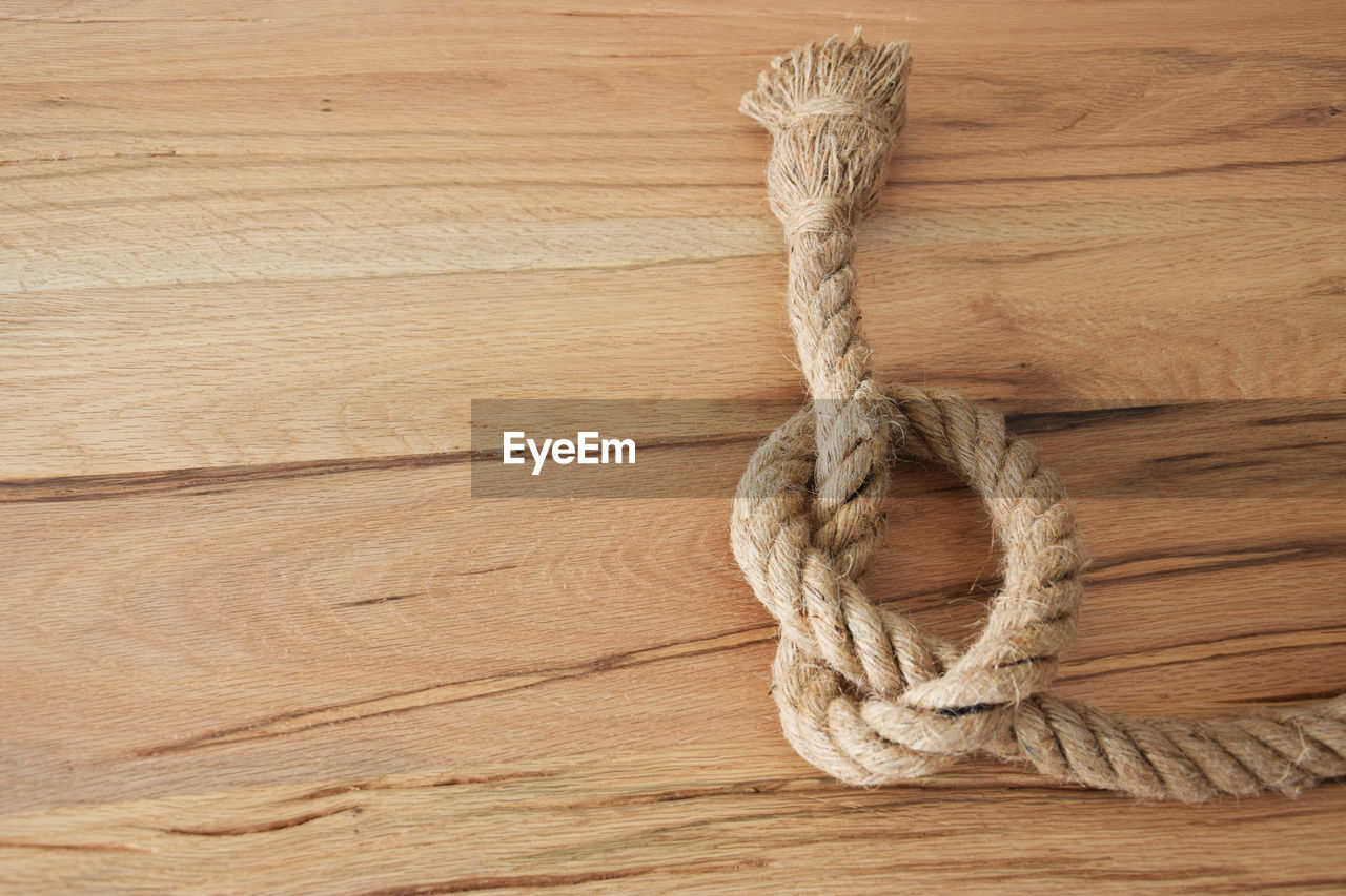 Close-up of rope on wooden table