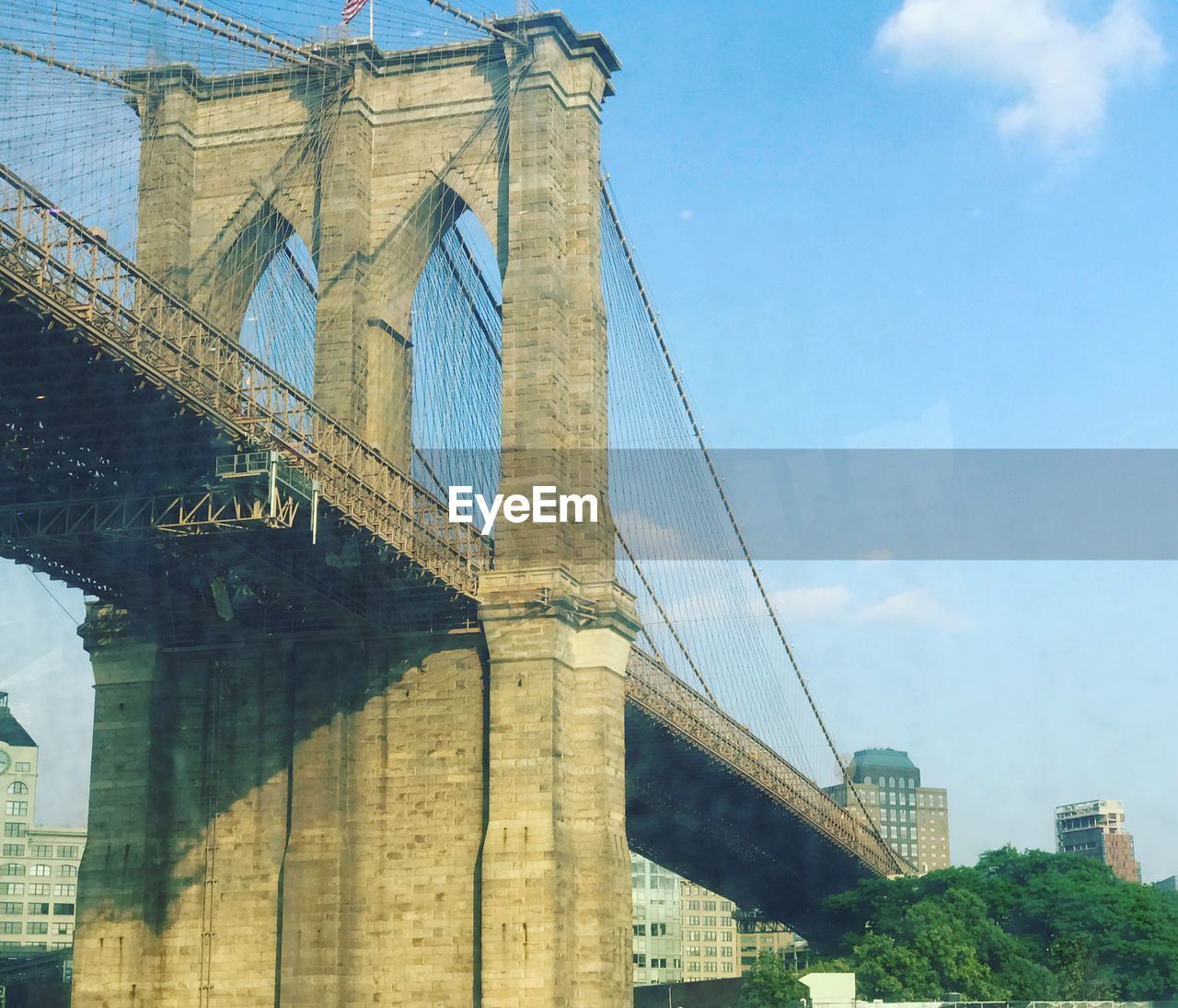 LOW ANGLE VIEW OF SUSPENSION BRIDGE CABLES AGAINST SKY