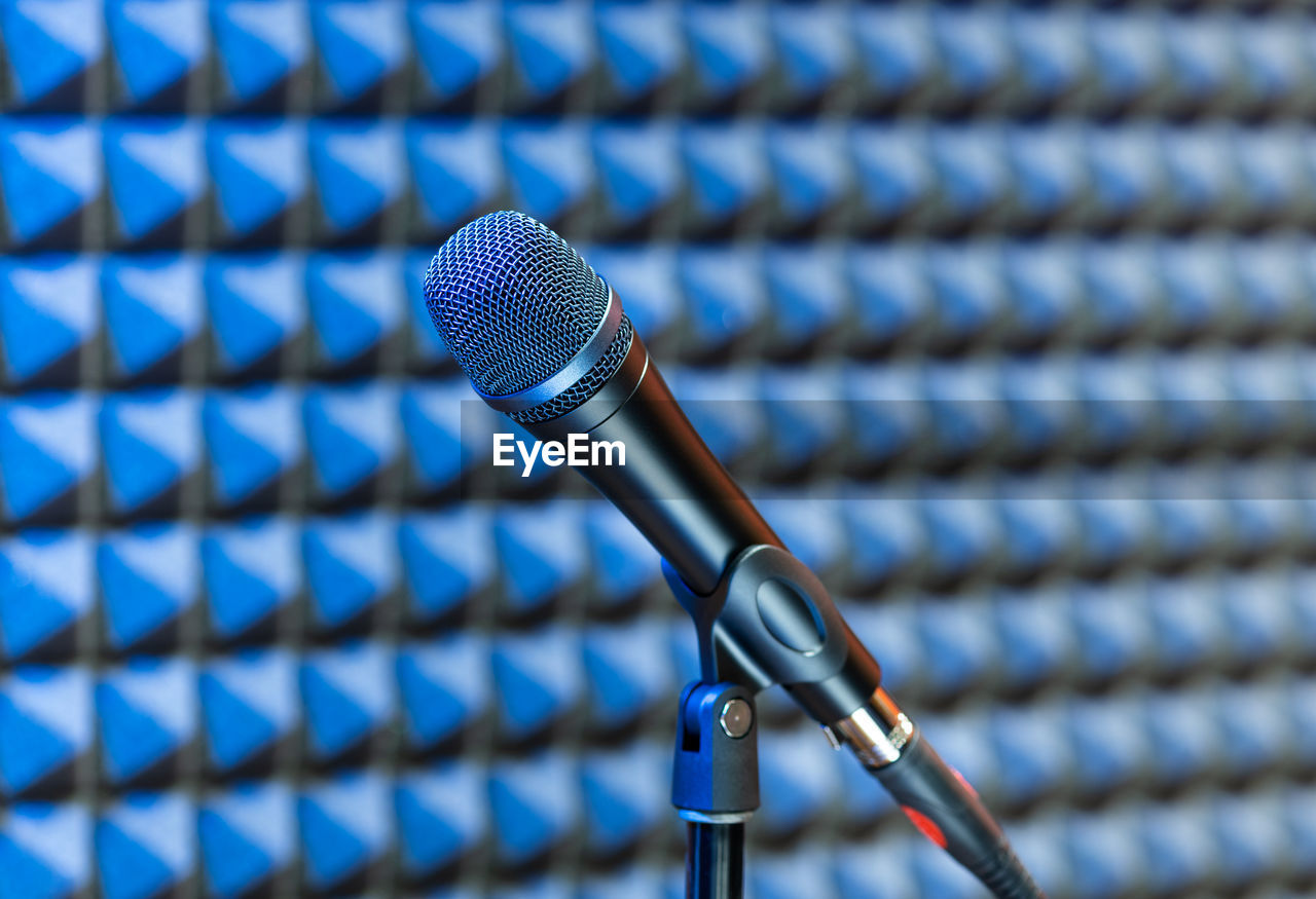 input device, microphone, technology, audio equipment, electronic device, close-up, communication, music, cable, no people, blue, equipment, sound recording equipment, metal, focus on foreground, arts culture and entertainment, indoors