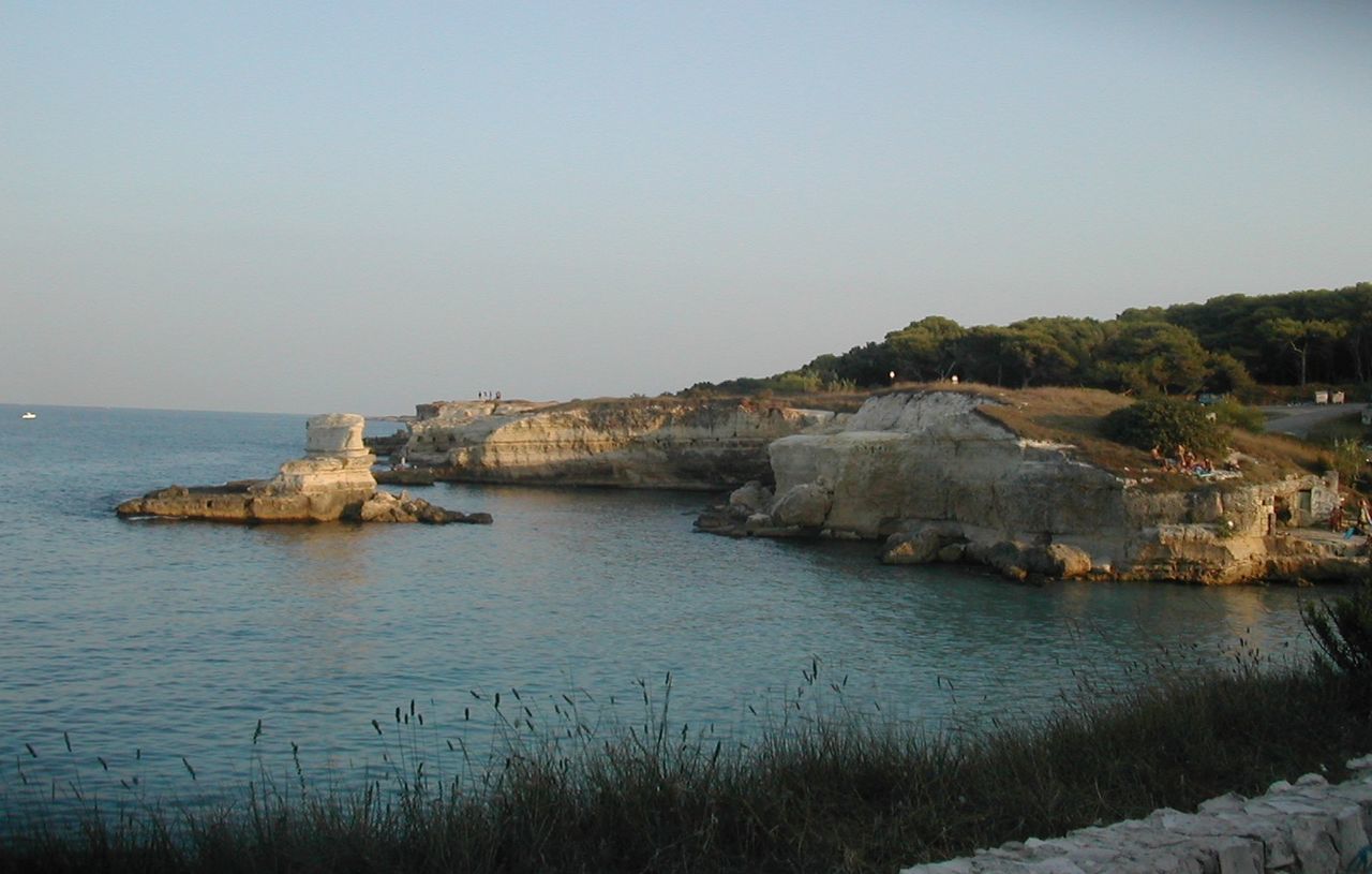 Scenic view of calm sea against cloudy sky