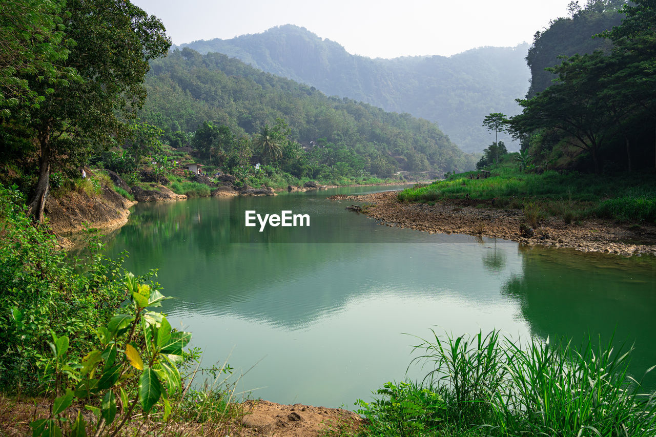 SCENIC VIEW OF LAKE AND MOUNTAINS