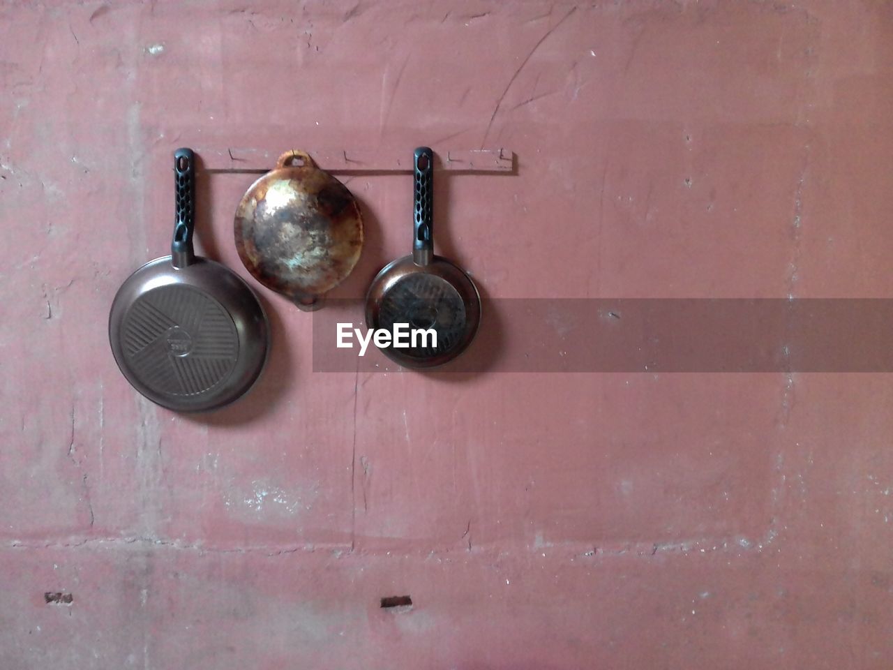 Utensils hanging on wall at home