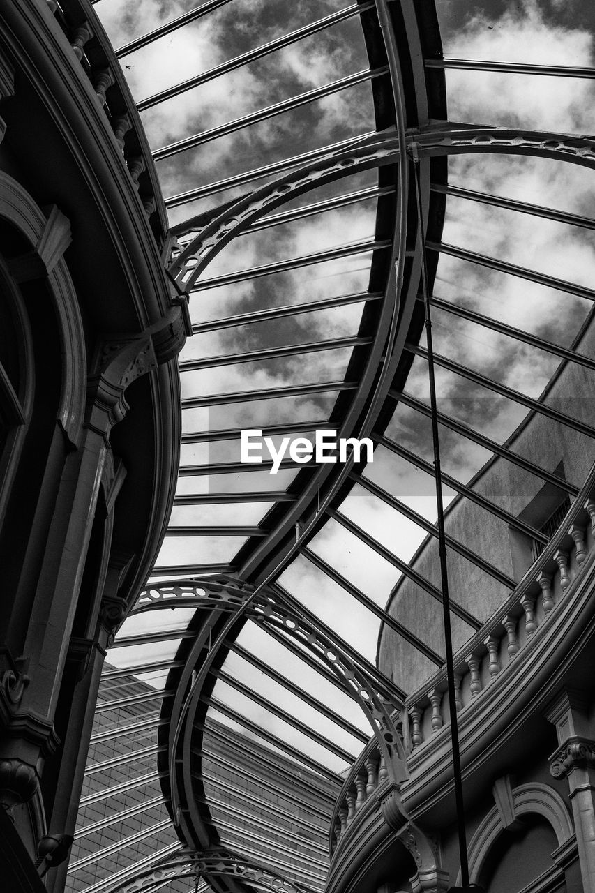 LOW ANGLE VIEW OF SPIRAL STAIRCASE OF BUILDING