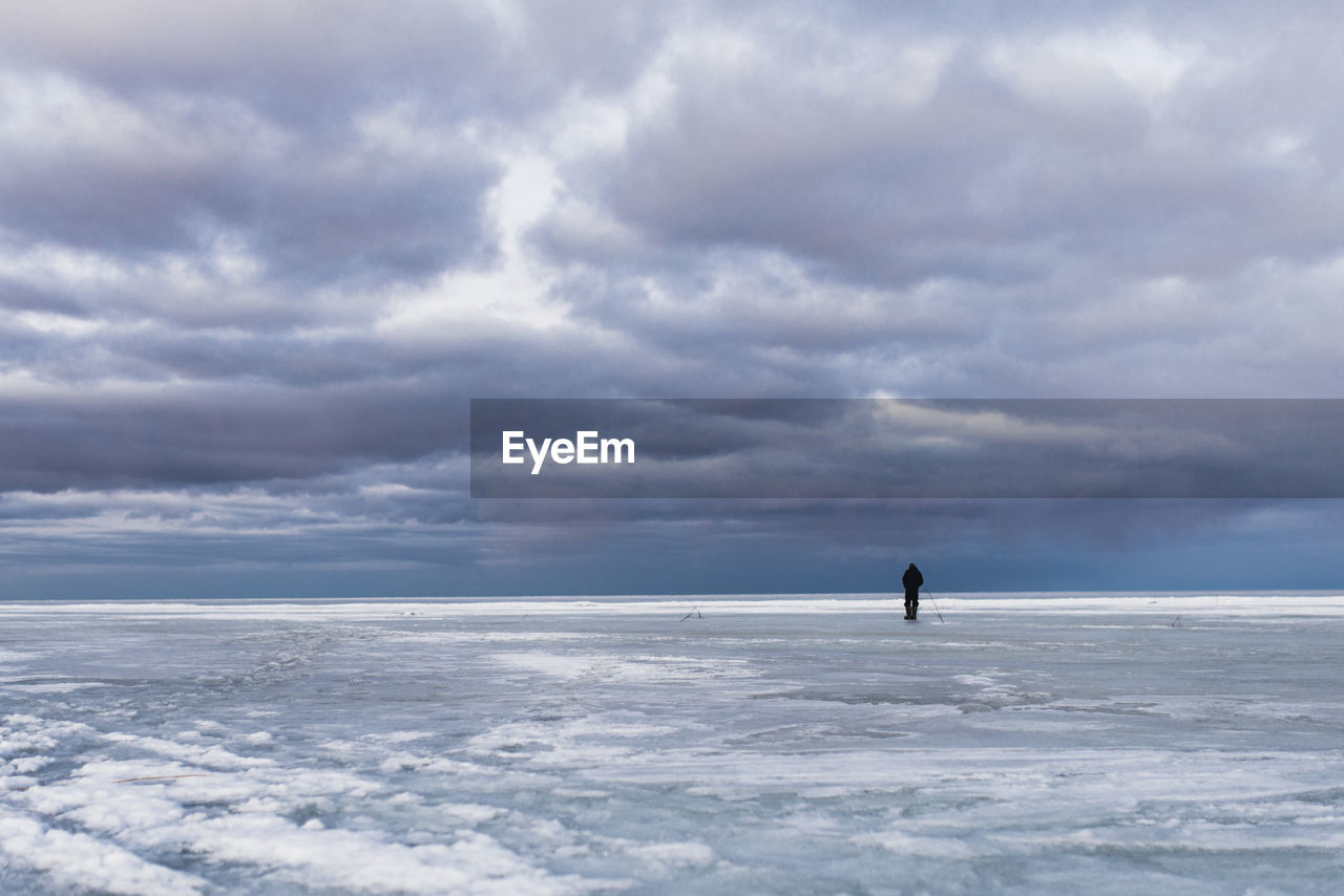 Frozen sea against sky