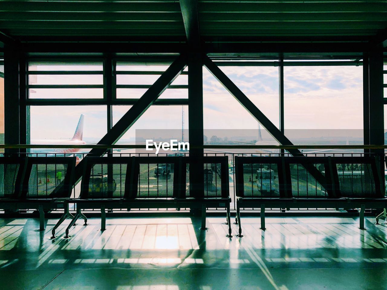 BRIDGE IN AIRPORT AGAINST SKY