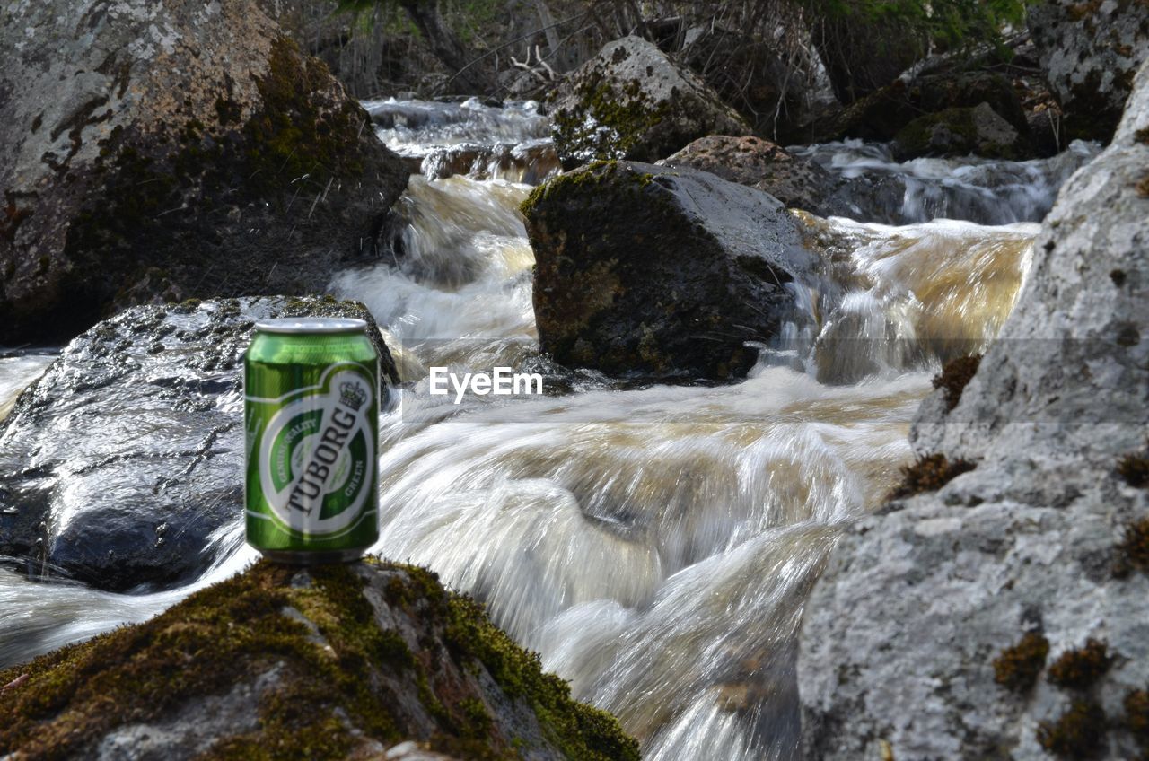 SCENIC VIEW OF WATERFALL AND RIVER