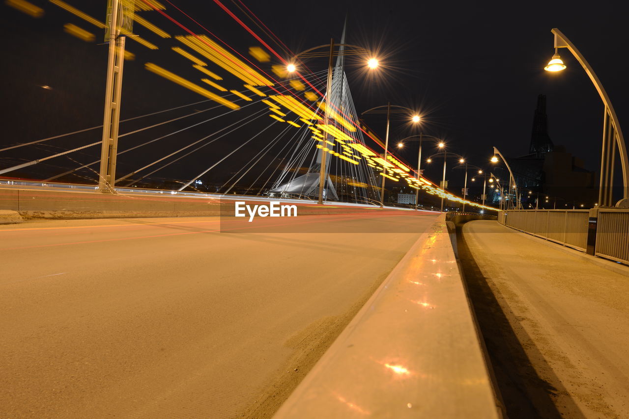 Light trails on suspension bridge at night