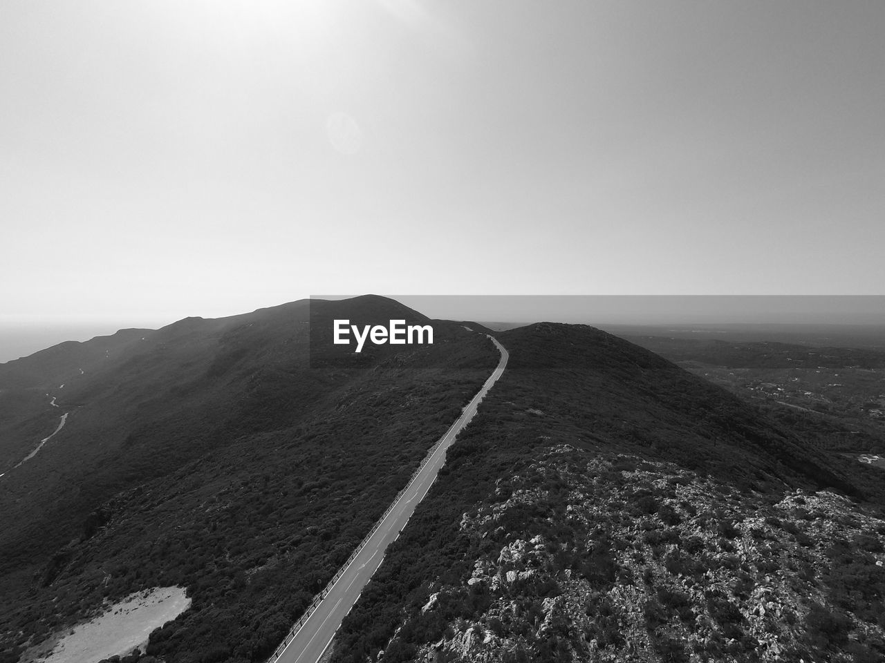 Scenic view of mountain road against sky
