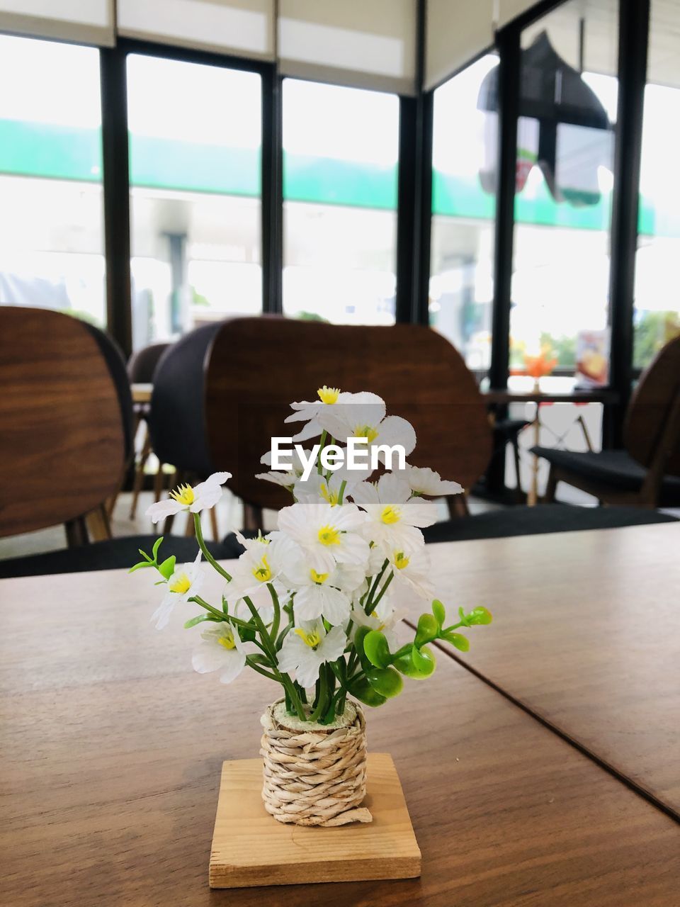 A vase of flowers placed on a wooden table