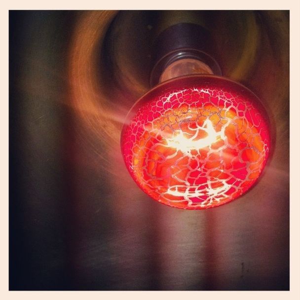 CLOSE-UP OF RED LIGHT BULB