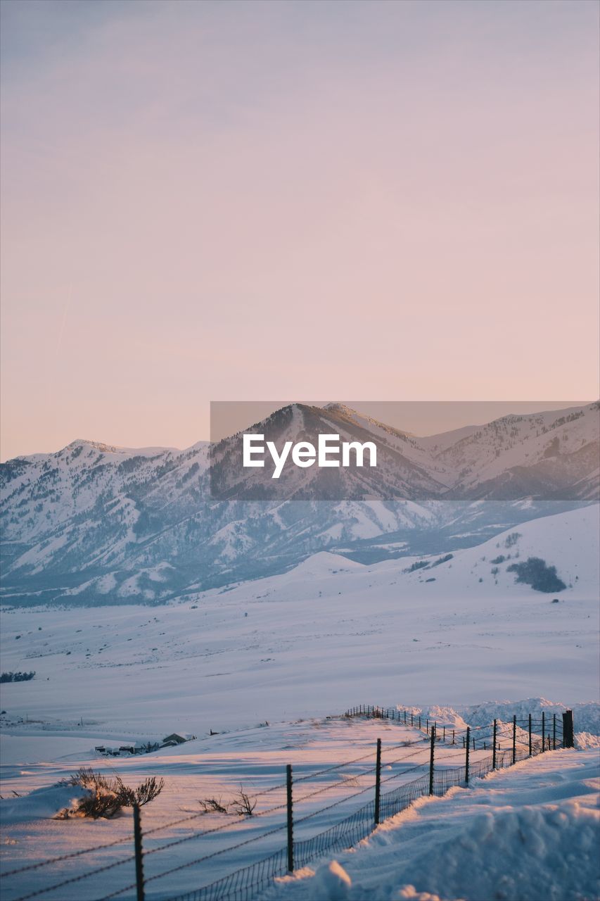Scenic view of snowcapped mountain against sky during winter