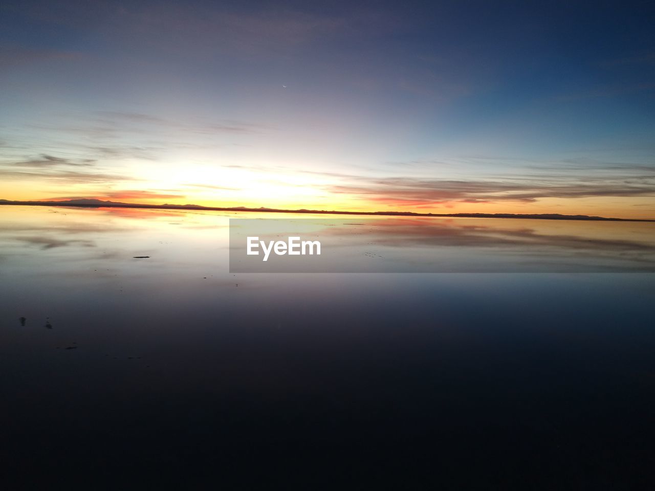 SCENIC VIEW OF SEA DURING SUNSET