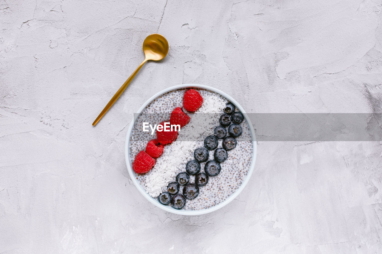 Overnight chia seed pudding with fresh berries in bowl, copy space