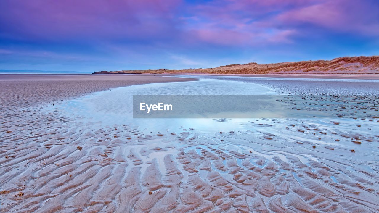 BEACH AGAINST SKY