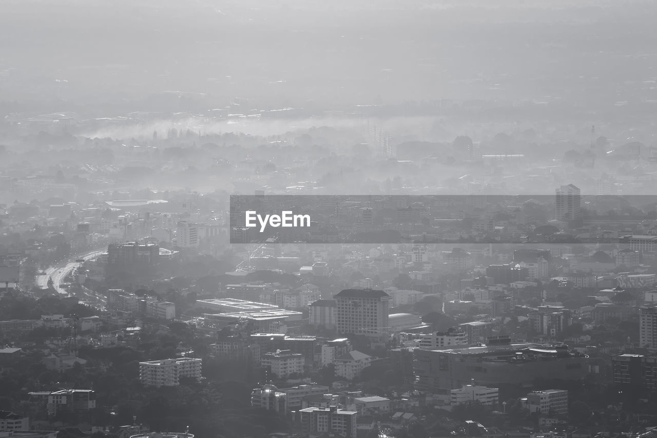 Aerial view of cityscape against sky