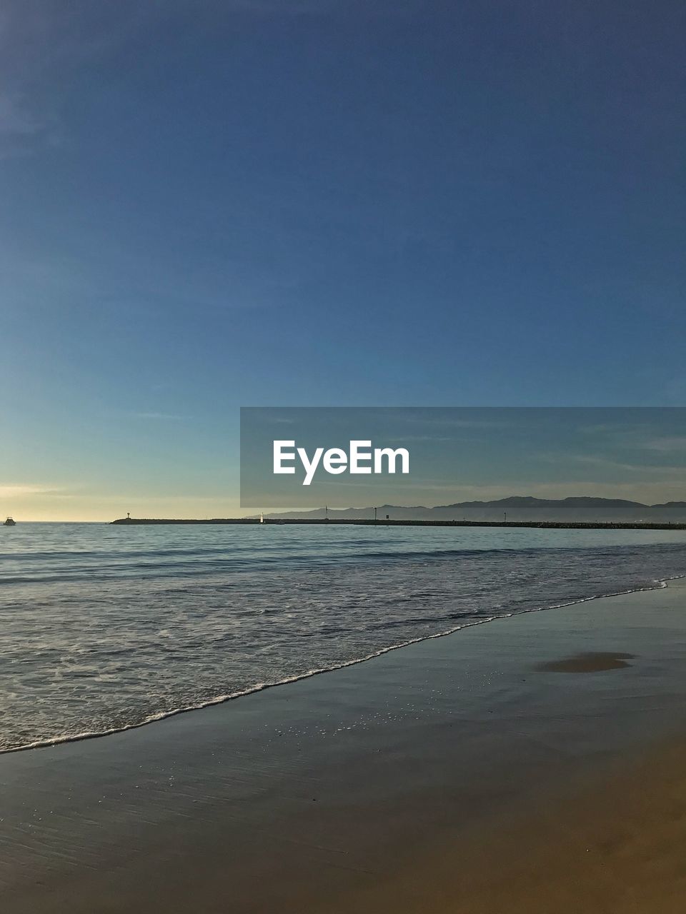 VIEW OF BEACH AGAINST SKY