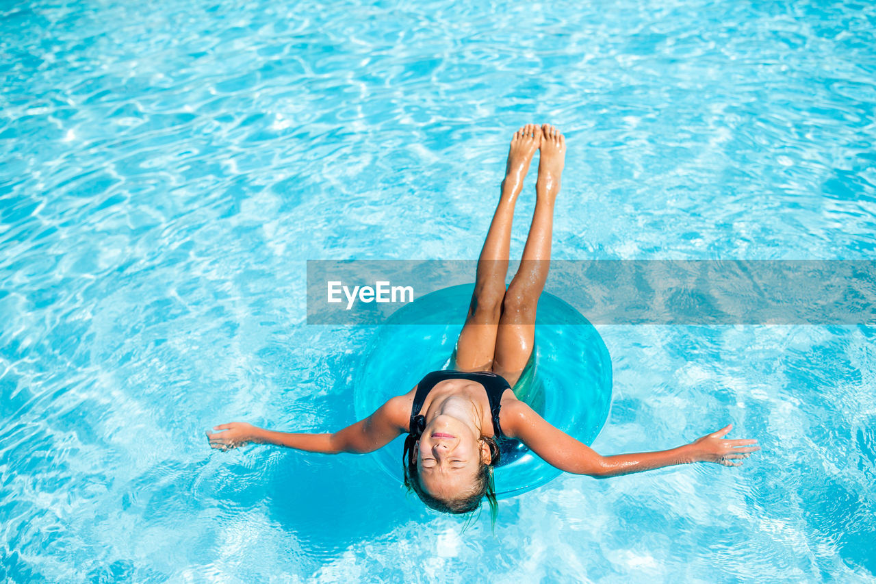 Woman swimming in pool