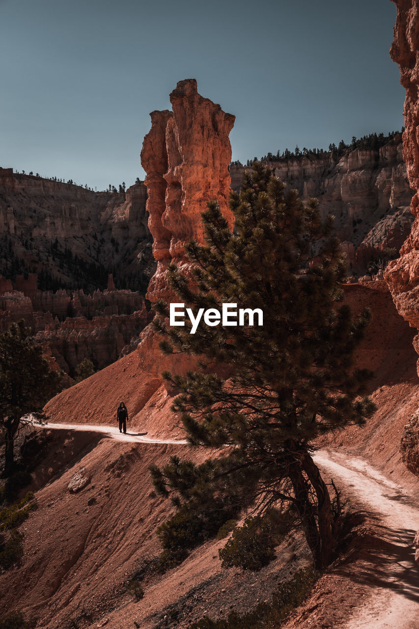 Rock formations on landscape against sky