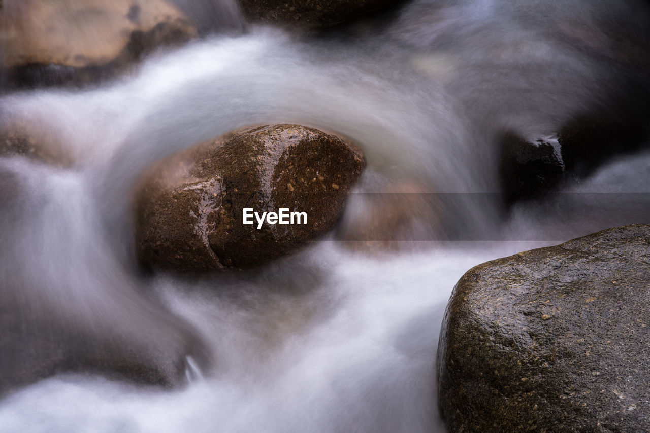BLURRED MOTION OF WATER FLOWING THROUGH ROCKS