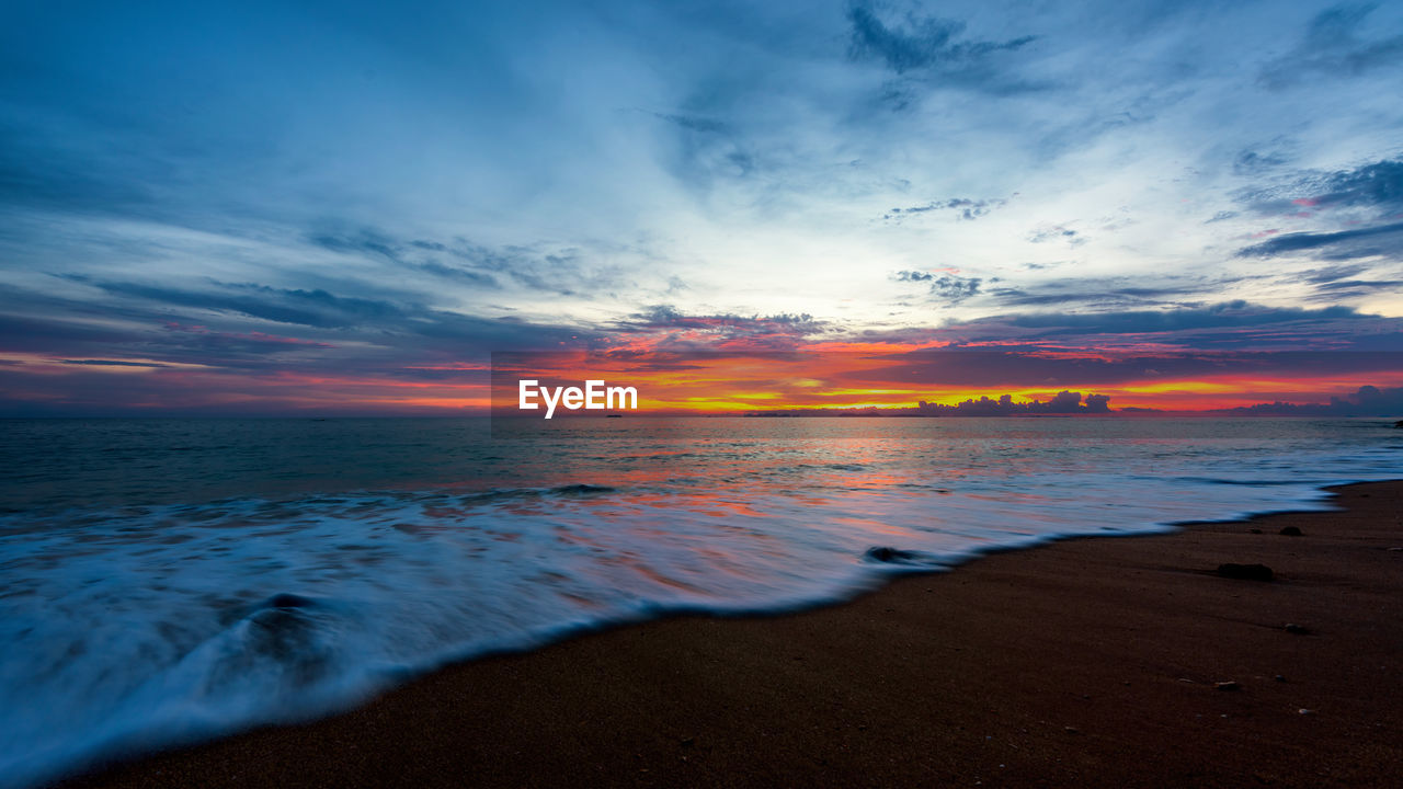 Scenic view of sea against sky during sunset