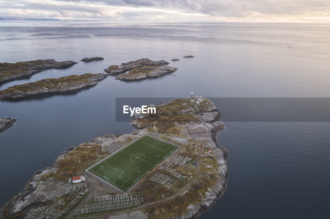 Soccer field on the cliffs of henningsvær by the sea