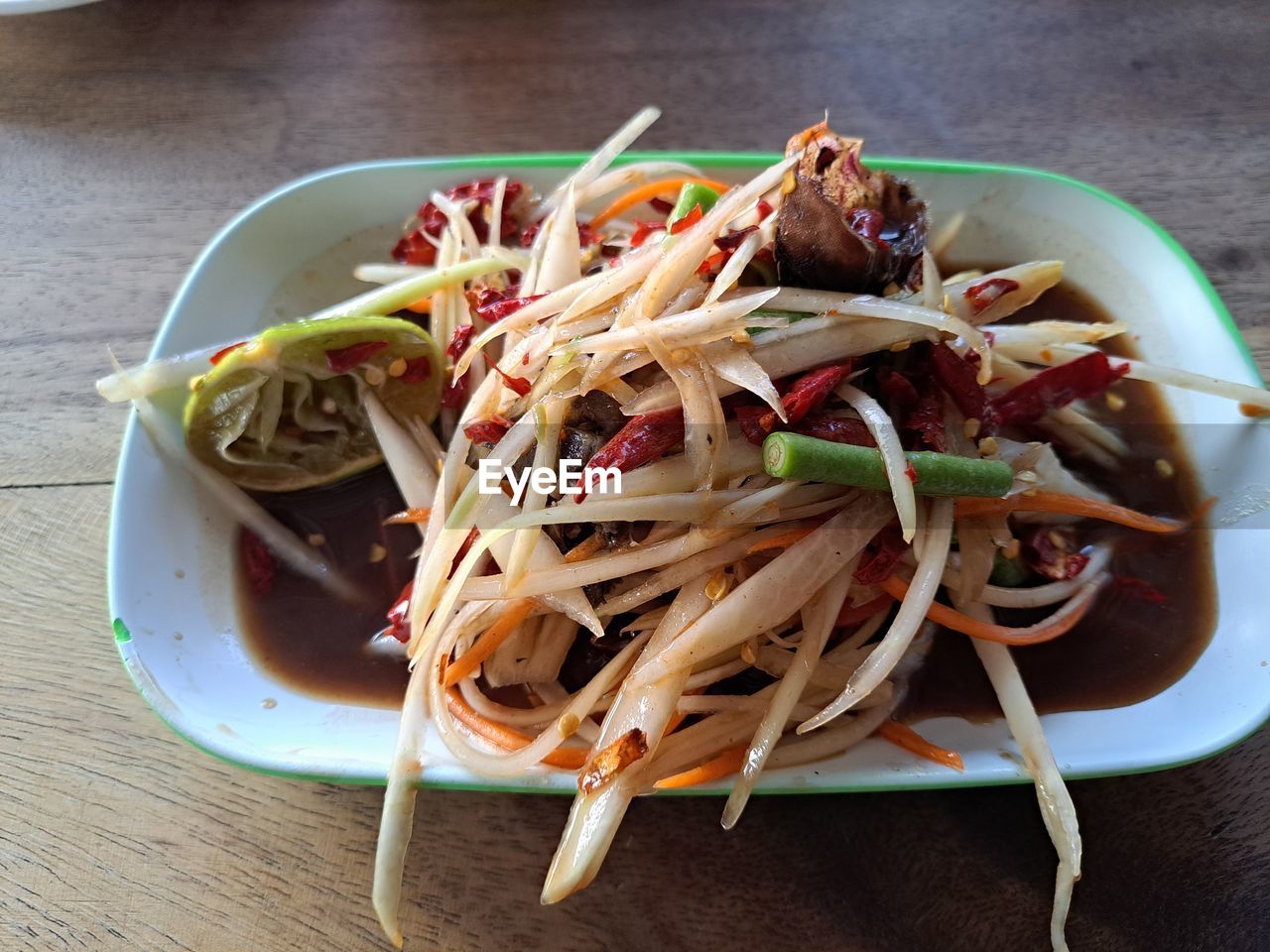 food and drink, food, healthy eating, dish, wellbeing, freshness, produce, italian food, vegetable, pasta, plate, cuisine, green papaya salad, no people, spaghetti, thai food, indoors, asian food, table, salad, meal, high angle view, pad thai, close-up, chopsticks, wood, chow mein, still life, stir-fried, bowl