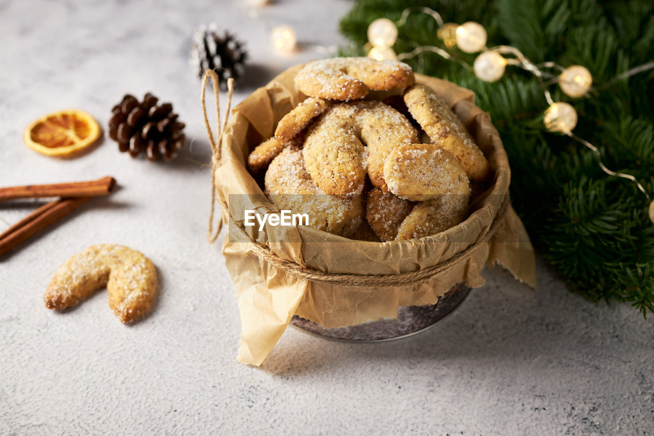 Half-moon shaped vanilla walnut shortbread cookies vanillekipferl. traditional pastries 