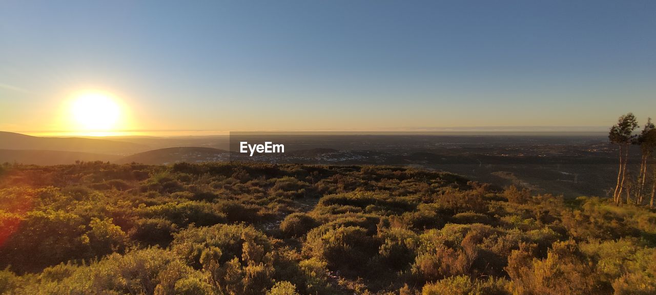 SCENIC VIEW OF LANDSCAPE AGAINST SKY AT SUNSET