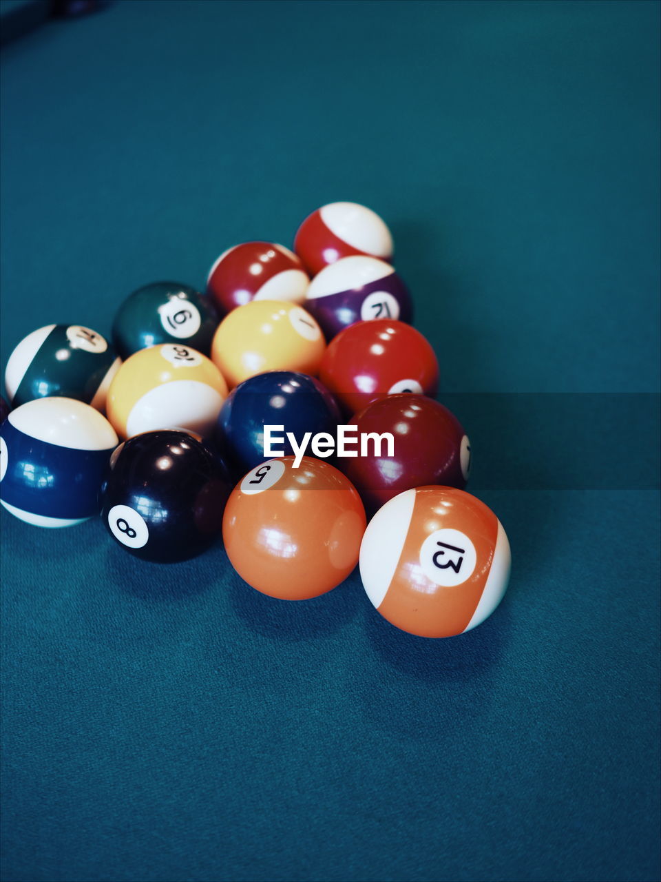 Close-up of pool balls arranged on table